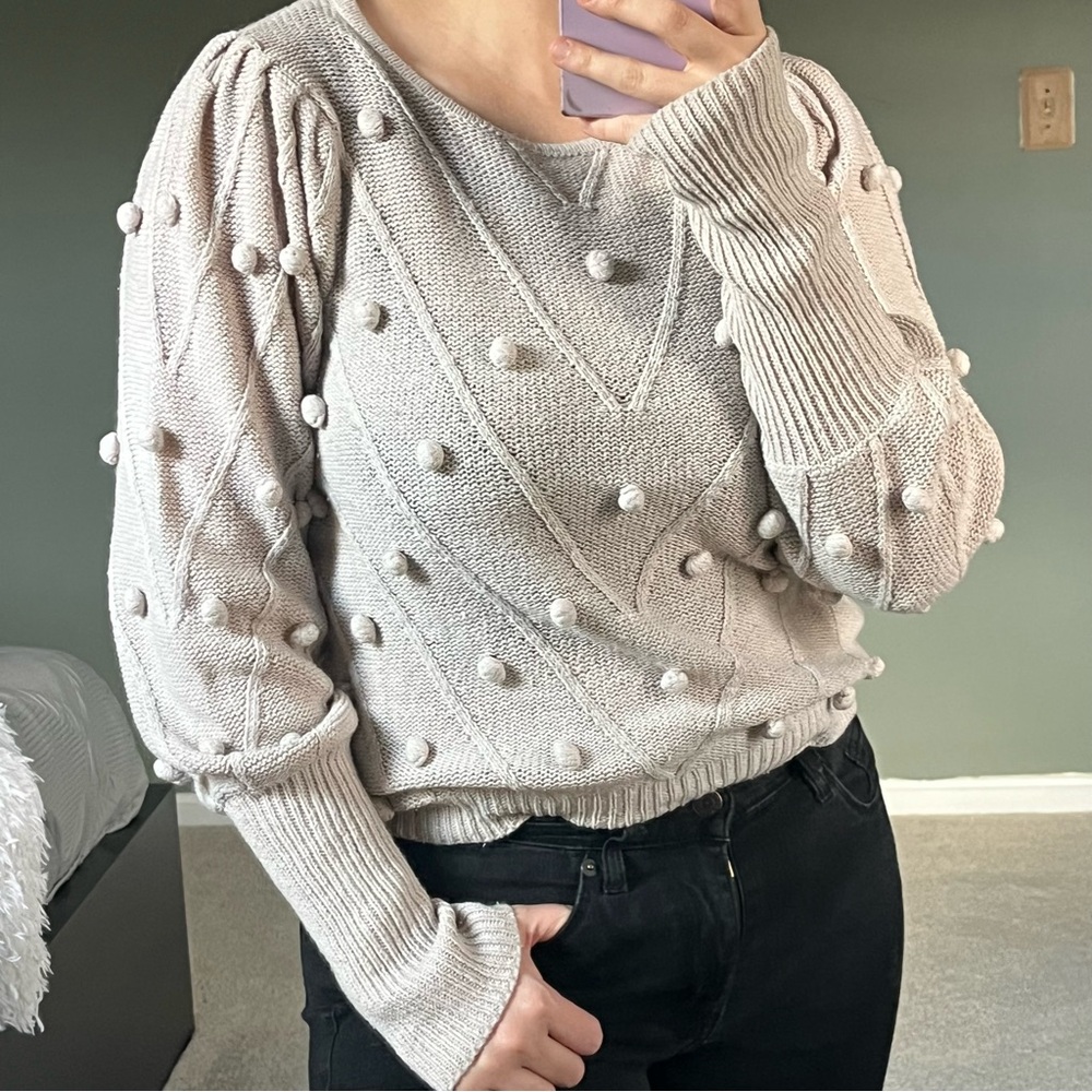 Fate light pink cream sweater with texture designs on the chest